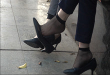 Short brown hair, feet dangling